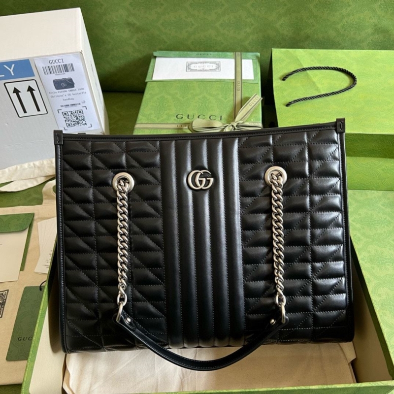 G*u*i shopping bags